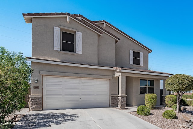 view of front of property featuring a garage