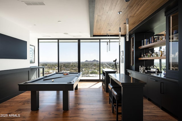 playroom featuring billiards, expansive windows, wooden ceiling, dark hardwood / wood-style flooring, and wet bar