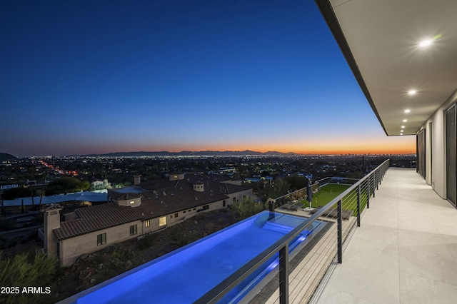 view of balcony at dusk