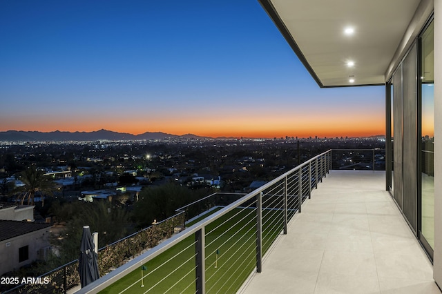 balcony at dusk with a mountain view