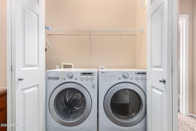 laundry room with washer and dryer