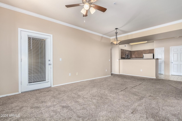 unfurnished living room with light carpet, ceiling fan, and crown molding