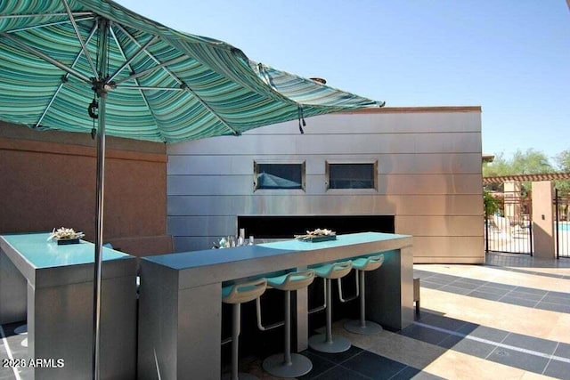 view of patio / terrace with exterior bar