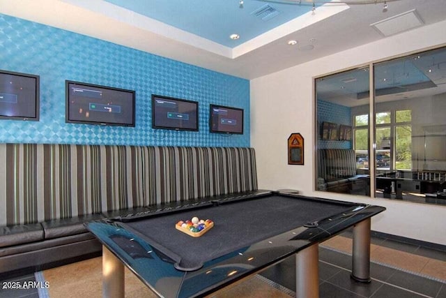 recreation room with pool table, a raised ceiling, and tile patterned flooring