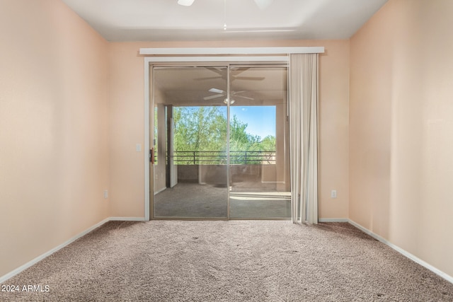 empty room with carpet and ceiling fan