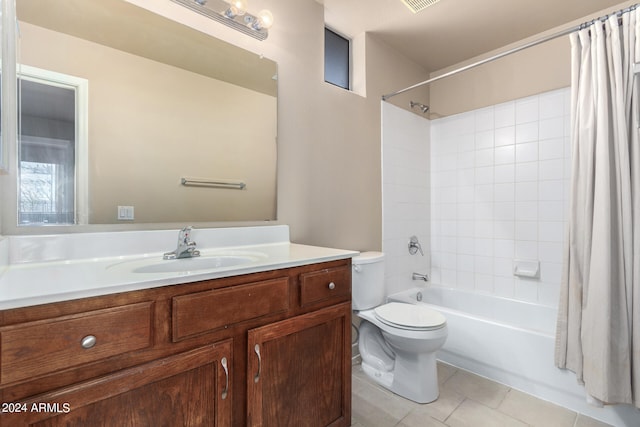 full bathroom featuring toilet, shower / bath combination with curtain, tile patterned floors, and vanity