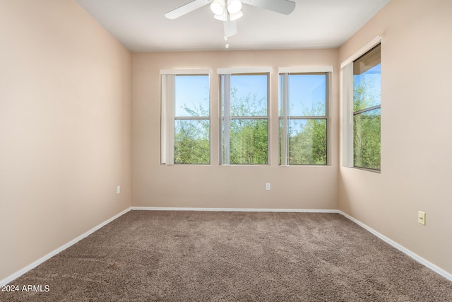 spare room with carpet and ceiling fan