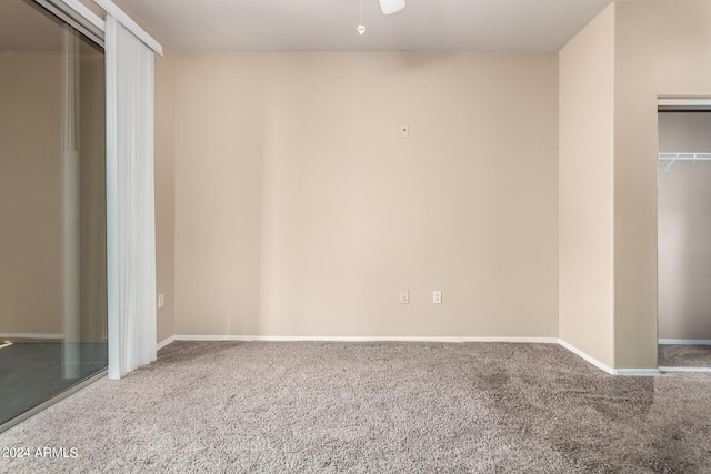 unfurnished bedroom with a closet and carpet flooring