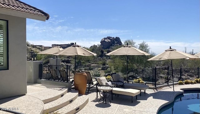 view of patio / terrace featuring a fenced in pool