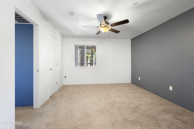 1185 W University Ave Unit 213, Flagstaff, AZ 86001 - unfurnished bedroom featuring carpet floors and a ceiling fan
