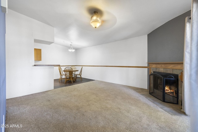 1185 W University Ave Unit 213, Flagstaff, AZ 86001 - spare room with a tiled fireplace and carpet flooring