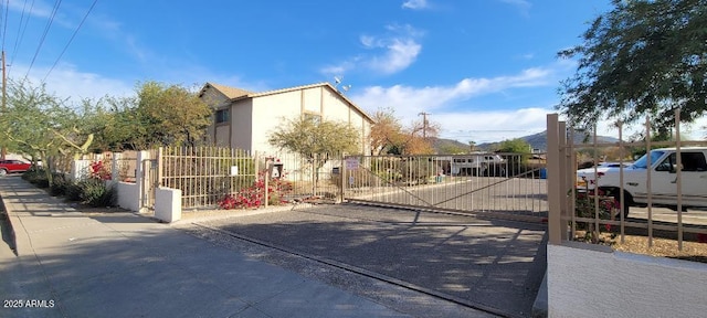 view of gate with fence