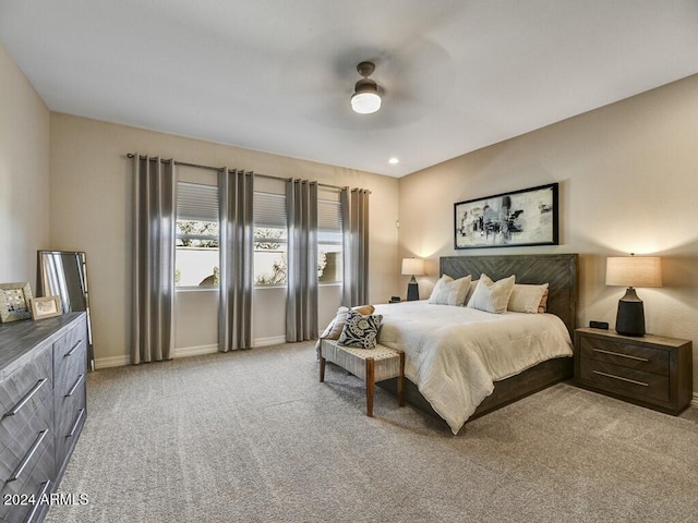 bedroom with light colored carpet and ceiling fan