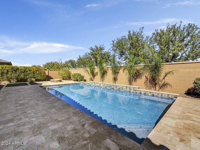 view of swimming pool featuring a patio