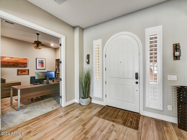 entryway with light hardwood / wood-style flooring