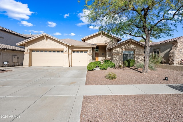 view of front of property with a garage