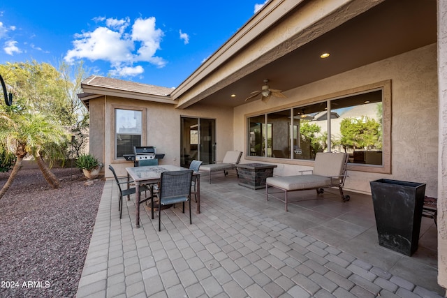 view of patio / terrace with grilling area and ceiling fan