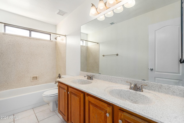 bathroom with toilet, tile patterned flooring, double vanity, and a sink