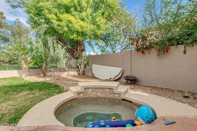 view of swimming pool with a fenced backyard