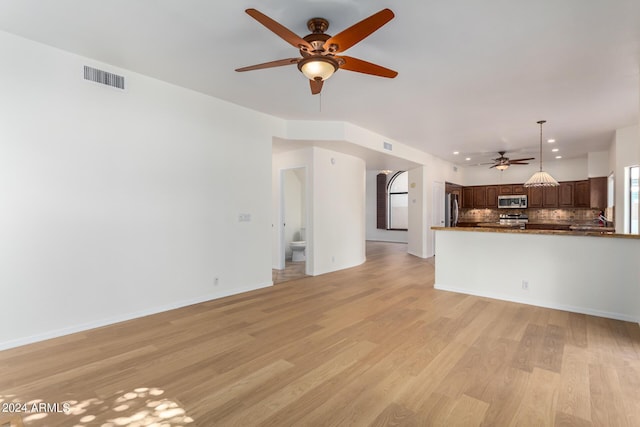 unfurnished living room with recessed lighting, visible vents, light wood-style flooring, ceiling fan, and baseboards