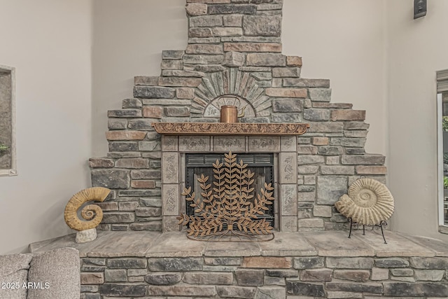 interior details with a fireplace with raised hearth