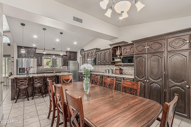dining area with visible vents, recessed lighting, light tile patterned flooring, and lofted ceiling