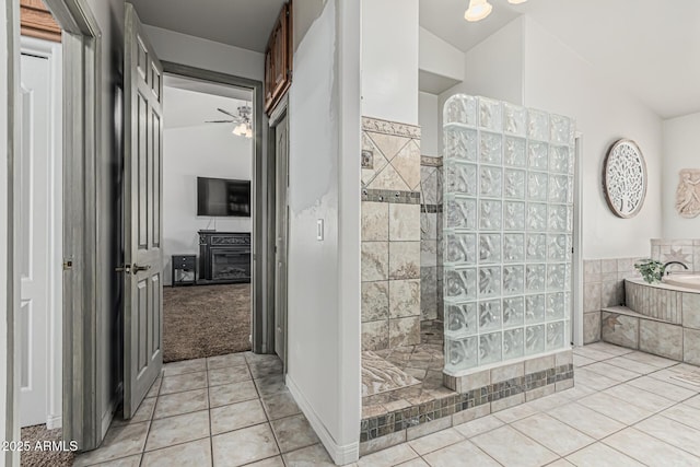 bathroom with a walk in shower, tile patterned floors, ceiling fan, and lofted ceiling