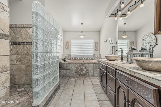 bathroom featuring a sink, a walk in shower, double vanity, and a bath