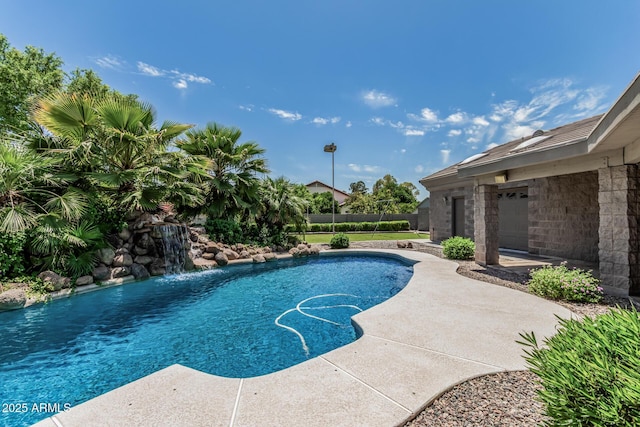 view of swimming pool with fence, a fenced in pool, and a patio