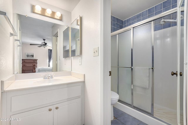 ensuite bathroom featuring a stall shower, connected bathroom, toilet, and tile patterned floors