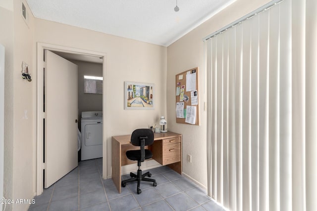 office featuring washer / dryer, light tile patterned floors, and visible vents