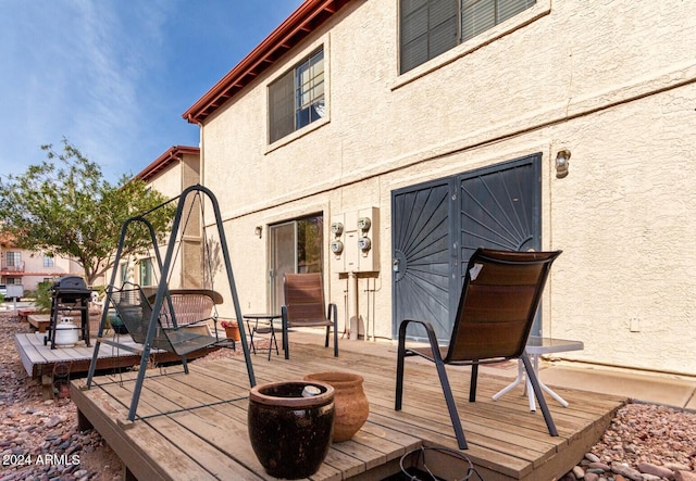 wooden terrace featuring area for grilling