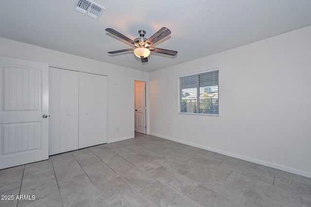 unfurnished bedroom with a closet and ceiling fan