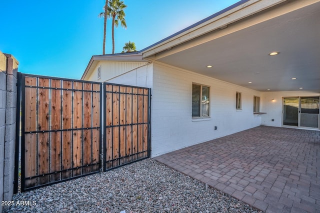 view of side of home featuring a patio