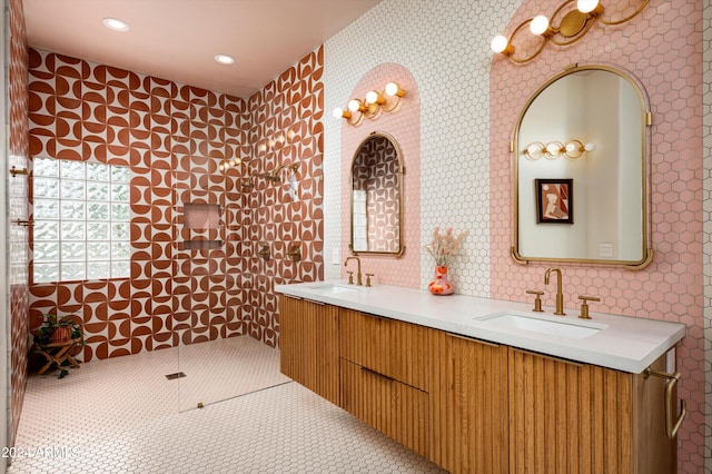 bathroom with tile patterned floors, walk in shower, and vanity