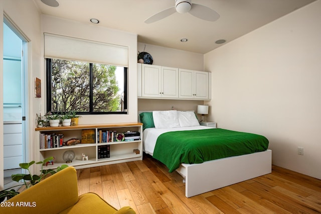 bedroom featuring ceiling fan and light hardwood / wood-style flooring