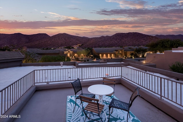 balcony at dusk with a mountain view