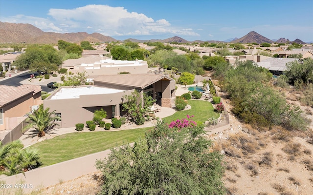 birds eye view of property with a mountain view