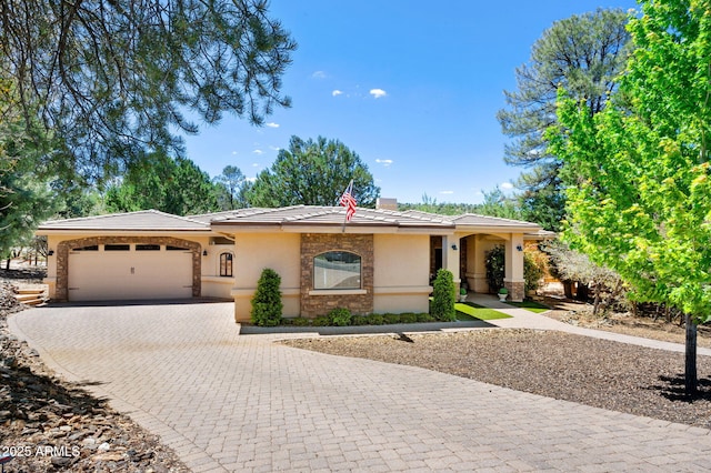 26 N Woodridge Cir, Prescott, AZ 86303 - ranch-style house featuring an attached garage, stucco siding, decorative driveway, stone siding, and a tile roof