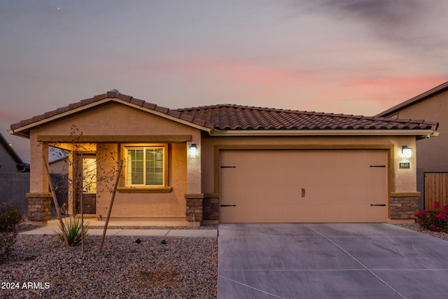 view of front of home with a garage