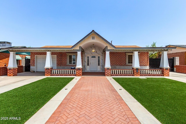 3316 E Fillmore St, Phoenix, AZ 85008 - view of front of property featuring covered porch, brick siding, a front lawn, and an attached garage