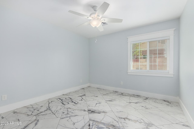 3316 E Fillmore St, Phoenix, AZ 85008 - spare room with ceiling fan and marble look tiles