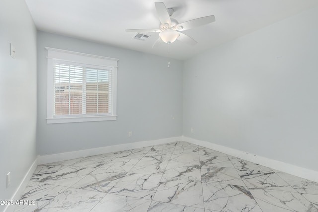 3316 E Fillmore St, Phoenix, AZ 85008 - spare room with a ceiling fan and marble look tiles