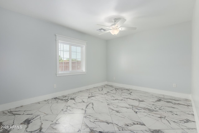 3316 E Fillmore St, Phoenix, AZ 85008 - unfurnished room with a ceiling fan and marble look tile flooring