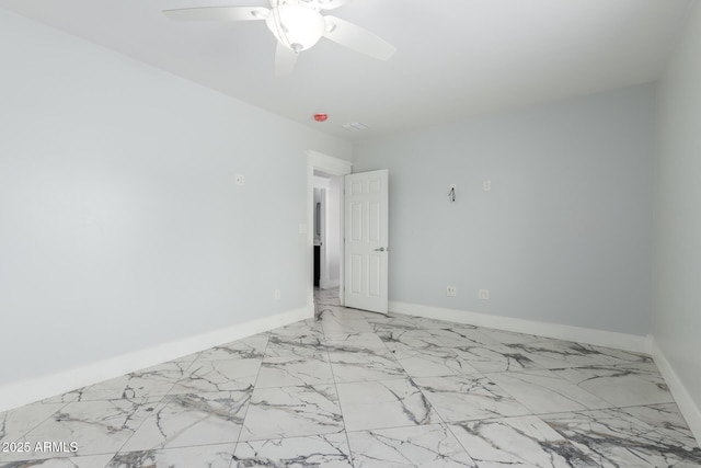 3316 E Fillmore St, Phoenix, AZ 85008 - spare room with a ceiling fan and light marble finish flooring