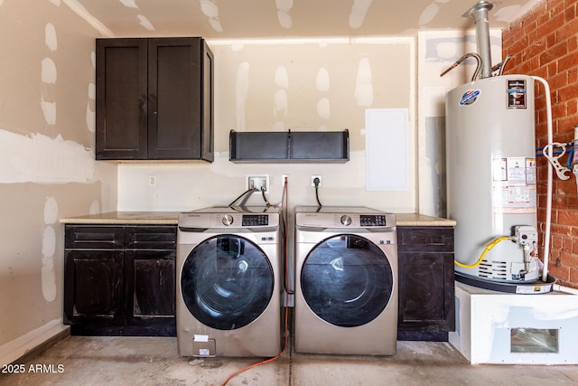 3316 E Fillmore St, Phoenix, AZ 85008 - laundry area featuring water heater, cabinet space, washing machine and clothes dryer, and brick wall