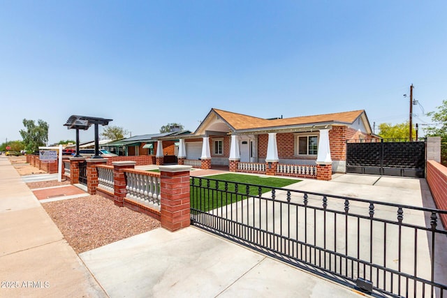 3316 E Fillmore St, Phoenix, AZ 85008 - view of front of property featuring covered porch, a fenced front yard, brick siding, and a gate