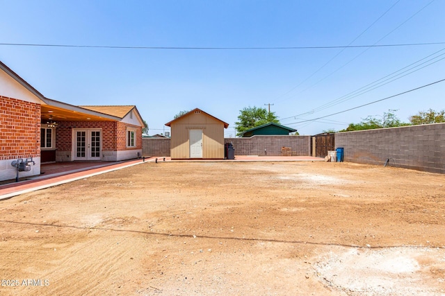 3316 E Fillmore St, Phoenix, AZ 85008 - view of yard featuring french doors and a storage shed