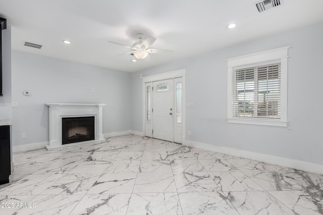 3316 E Fillmore St, Phoenix, AZ 85008 - unfurnished living room featuring a ceiling fan, a fireplace, recessed lighting, and marble finish floors