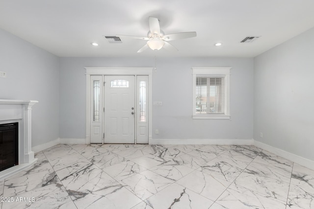3316 E Fillmore St, Phoenix, AZ 85008 - entrance foyer with ceiling fan, recessed lighting, a fireplace, and marble finish floors
